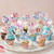 Pastel mermaid cupcake topper set with ocean themed decorations