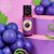 Vivid Grape Flavour Fusion Baking Emulsion – 21ml, a small red plastic bottle with a black cap and a label featuring a purple grape illustration, surrounded by fresh purple grapes and green leaves on a pink backdrop.