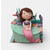 Handmade gumpaste mermaid cake topper sitting on a pastel mermaid themed birthday cake