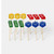 Pack of 12 Lego-inspired glitter cupcake toppers featuring colourful building block pieces and smiling character faces