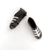 Mini black and white soccer boots cake decorations measuring approximately 3cm x 1cm for football themed cakes