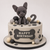 Personalised puppy birthday cake with handmade edible dog, paw prints, dog bones, balloons, grass and custom age in blue and neutral colours.