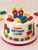 Handmade building block edible cake decorations with colourful bricks and block-style character figures