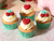 PME Mon Cheri Edible Icing Decorations 12 Pack featuring red heart and cherry cake toppers with green leaves, ideal for Valentine's Day cupcakes and cakes.