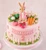 Peter Rabbit edible cake decorations with handmade blue jacket bunny, carrots, cabbages, apples and pumpkin.