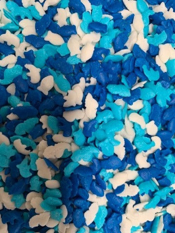 Blue, turquoise and white sea life sprinkle mix featuring ocean-themed shapes for mermaid and under the sea cakes.