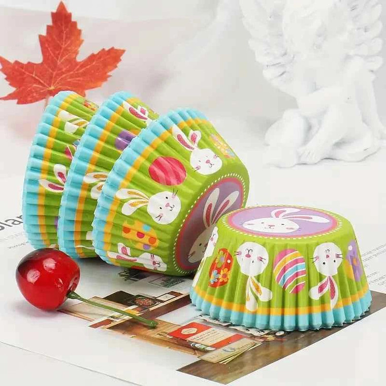 Easter Theme Baking Cups x25 Approx, colorful paper baking cups with Easter bunny and egg designs, suitable for cupcake baking for Easter celebrations.