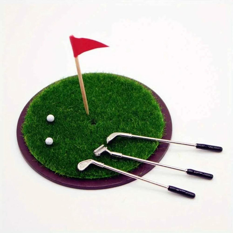 Miniature Golf Green With Tees, miniature golf green with a red flag, two golf balls, and three golf clubs, used for tabletop golf games or as decor.