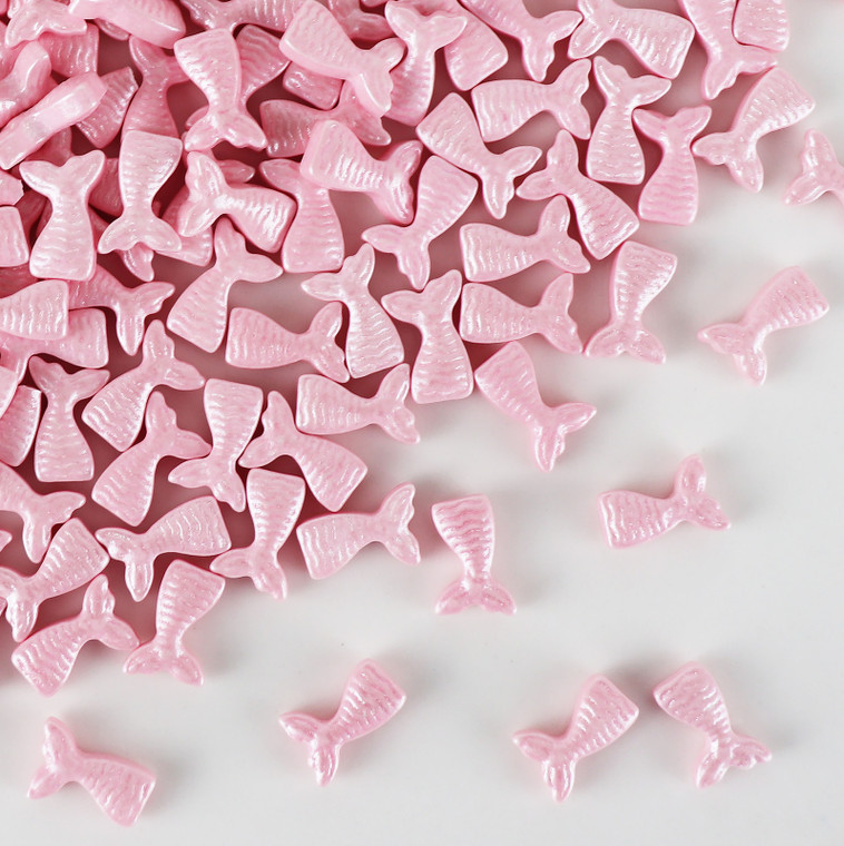 Pink edible mermaid tail sprinkles with pearlescent finish for mermaid themed cake decorating