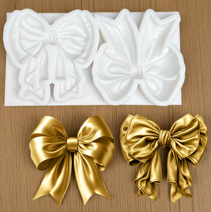 Bow silicone mould featuring two detailed ribbon bow designs for fondant, chocolate and cake decorating.
