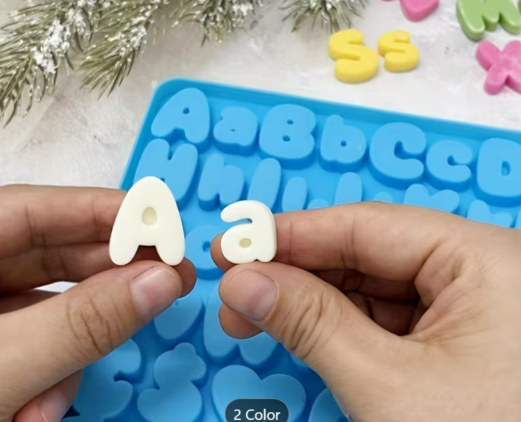 Blue alphabet and number silicone mould measuring 30cm x 20cm with letters, numbers and symbols for cake decorating.