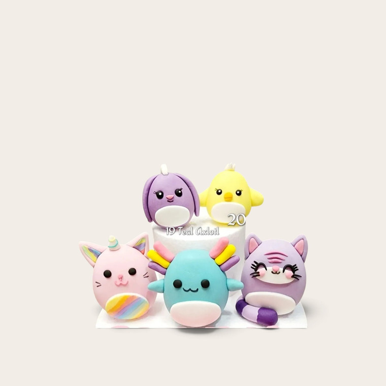 Handmade Squishmallow edible cake decorations in assorted cute animal, fantasy and colourful gumpaste character designs.