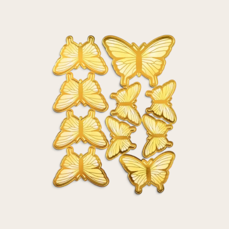 Pale yellow butterfly cake toppers with metallic gold edging and assorted butterfly designs