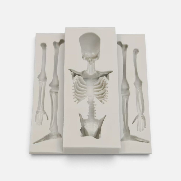 Skeleton Silicone Mould with skull, ribcage, pelvis, arm and leg bone cavities for Halloween cake decorating