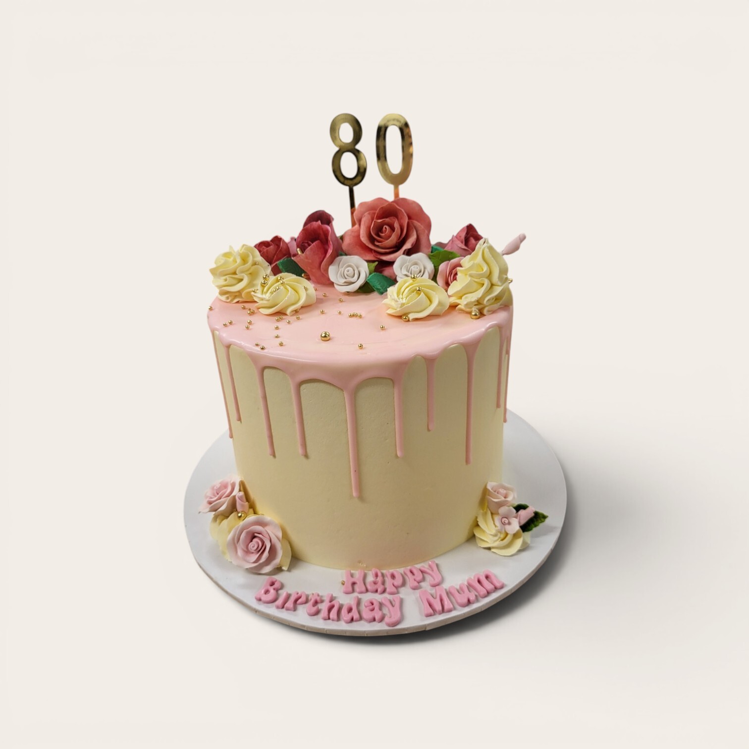 80th birthday flowers drip cake.jpg