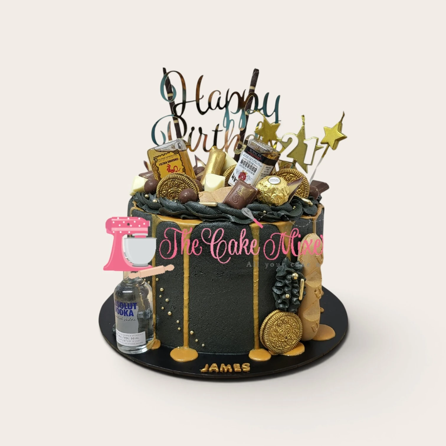 black and gold drip cake with bottles.jpg