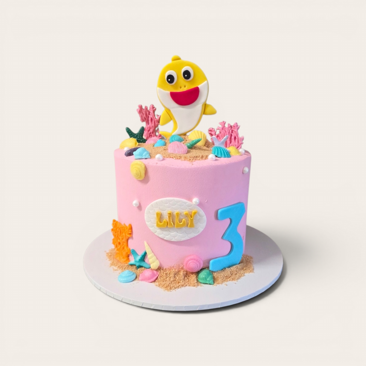 pastel pink baby shark cake.jpg