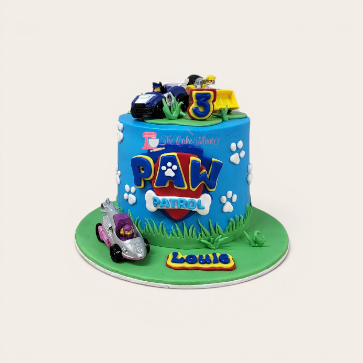 paw patrol cake with plastic vehicles.jpg