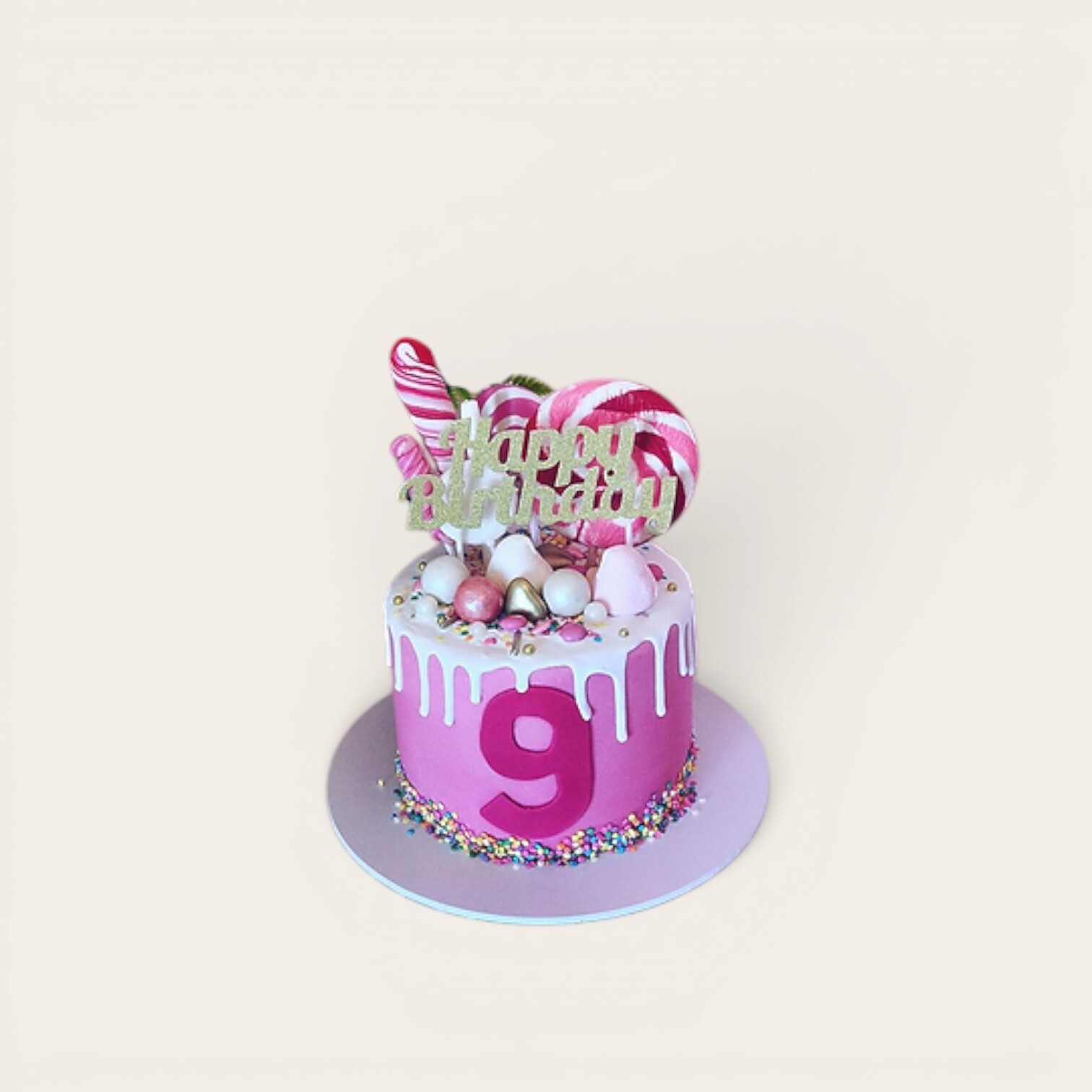 pink cake with white drip.jpg