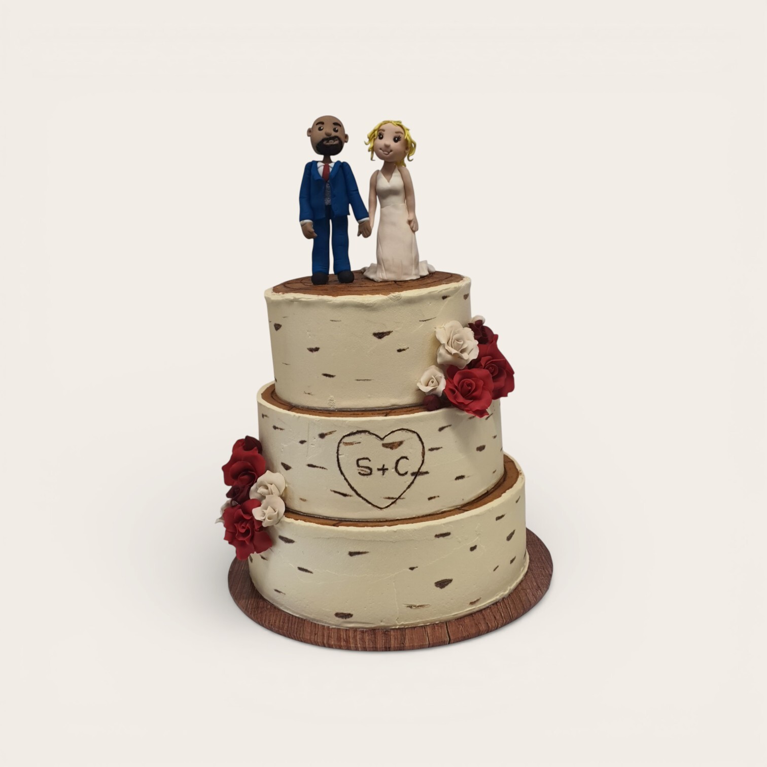 rustic wedding cake with bride and groom.jpg