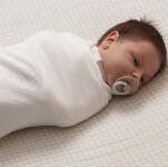 newborn-swaddled-in-the-sleep-store-organic-cotton-pointelle-swaddle-wrap-sqaure.jpg