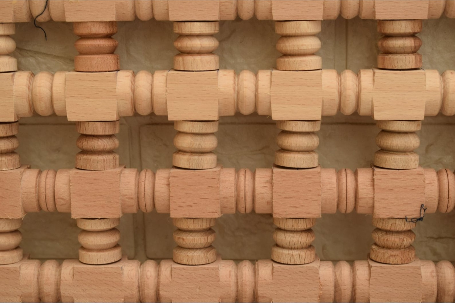 Framed turned spindle lattice panel in hand-cut solid wood