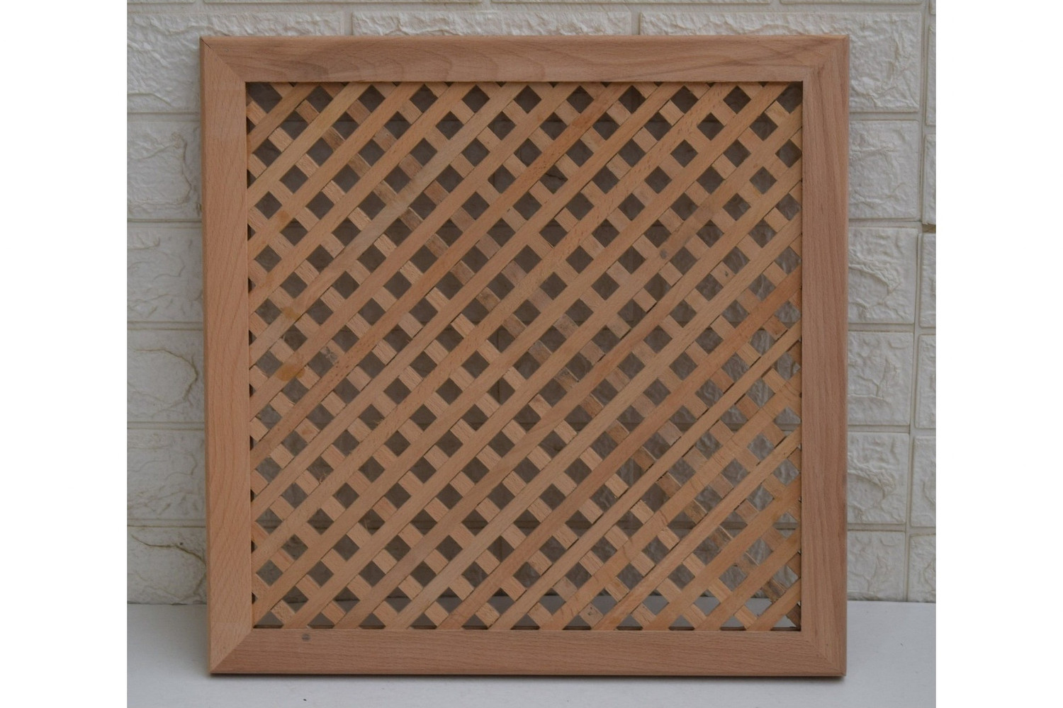 Diagonal diamond lattice panel in hand-cut solid wood