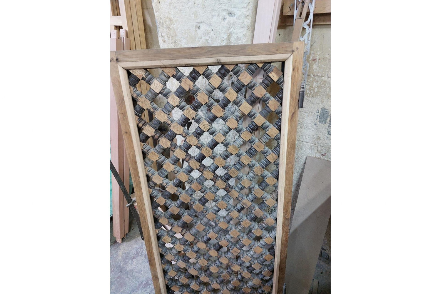 Diamond lattice room divider in hand-cut solid wood