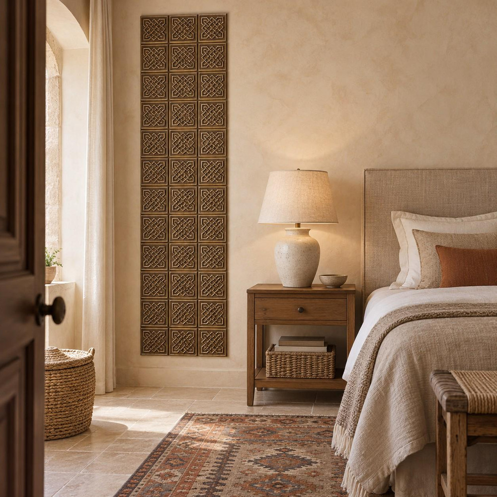 Framed Lattice Knot Celtic knot tiles in hand-embossed brass, as a tall vertical panel beside a bed in a bedroom
