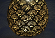 Intricate pierced brass ceiling lamp, authentic Moroccan lighting design that adds elegance and warmth to home interiors.