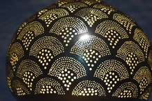 Moroccan brass outdoor ceiling pendant lamp casting patterned light, suitable for entryway or veranda to create a welcoming atmosphere.
