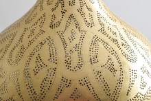 Moroccan brass boho hallway ceiling chandelier with detailed perforations, creating patterned light effects along corridors.