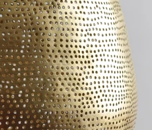 Brass Moroccan pendant lighting for kitchen islands, combining artisan craftsmanship with bohemian ceiling décor.