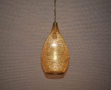 Moroccan style brass hanging light for kitchen island use, artisan-crafted with intricate cutouts, perfect for boho-inspired kitchens.