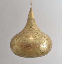 
Moroccan ceiling lamp adding ambiance to bohemian interior

Artisan brass pendant light with Moroccan style details

