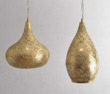 Handmade Moroccan light fixture with intricate brass cutouts
