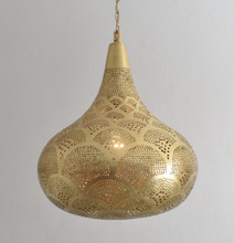 
Moroccan ceiling lamp adding ambiance to bohemian interior

Artisan brass pendant light with Moroccan style details

