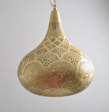 Kitchen island lighting featuring Moroccan 3-lamp brass cluster
