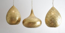 Moroccan brass pendant light cluster above a kitchen island