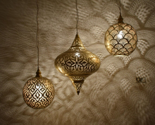Handmade Moroccan foyer lighting with brass hanging lamps