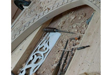 Arabesque arch panel — solid wood grain and finish detail