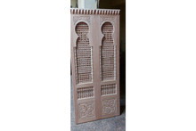 Double arched mashrabiya doors — solid wood grain and finish detail