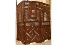 Mashrabiya room divider — solid wood grain and finish detail