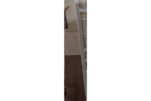 White mashrabiya screen — solid wood grain and finish detail