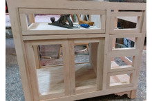 Mirrored vanity console in hand-cut solid wood