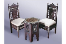 Hand-carved wood chairs and majlis bench — mashrabiya screenwork close-up