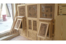 Mashrabiya balcony railing — full view of the handcrafted wooden panel
