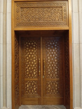Carved star geometric door — cream marquetry inlay detail