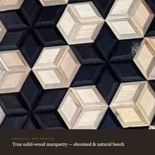 Macro close-up of hand-cut solid-wood marquetry in ebonised and natural beech
