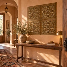 Hand-embossed solid brass Tudor rose tiles in aged bronze as a panel above a console table in an entrance hall